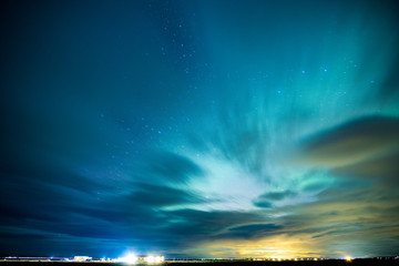 Fototapeta na wymiar Moving cloud with aurora background