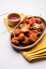 Mushroom 65, starter or appetiser food recipe from India. served in a plate with ketchup. selective focus