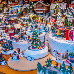 Fototapeta na wymiar Selective focus on traditional Christmas toys and decorations on display for sale at the 2019 Christmas market in Aachen, Germany