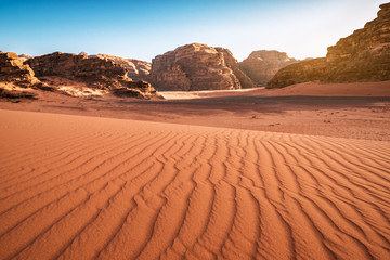 Fototapeta na wymiar red rocks and sand in desert