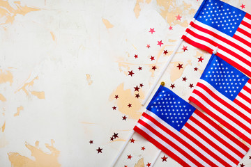 Fototapeta na wymiar USA flags and space for text on light background