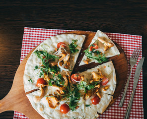Top view of German flammkuchen pizza on table