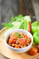 Northern Thai food (Nam Prik Ong), spicy chili minced pork with tomatoes  eating with fresh vegetables, Thai chili paste 