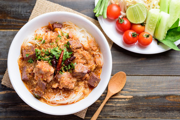 Northern Thai food (Kanom Jeen Nam Ngeaw), rice noodles with spicy soup eating with vegetables, top view