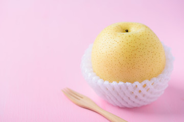 Fresh Asian pear fruit on pink background