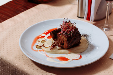 Filet mignon (small filet), the medallion is a piece of beef, cut thin section of the tenderloin. It is used to prepare delicious dishes of natural meat - filet mignon steaks.