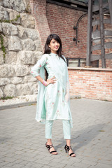Fototapeta na wymiar Traditional accessories of Indian girls. Girl in traditional Indian clothing, salwar kameez.