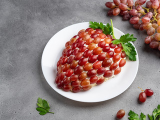 Healthy appetizer, tiffany chicken and cheese salad in the shape of cluster (bunch) of grapes on...