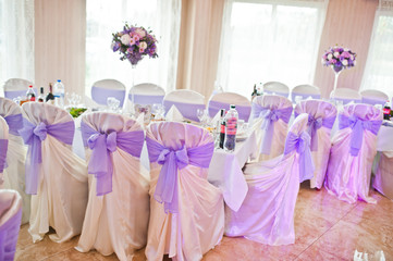 Beautiful wedding purple set decoration in the restaurant.