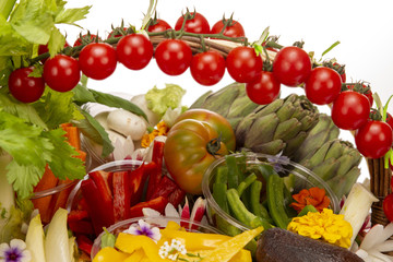 Gift basket with a selection of mixed vegetables on a white background