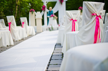 Fototapeta na wymiar Beautiful wedding set decoration in the outdoor ceremony.