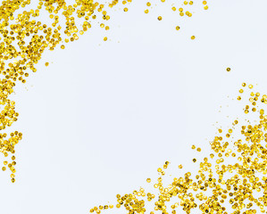 Golden sparkle glittering frame. Golden glitter sand texture frame on white, abstract background...