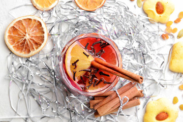 Christmas composition with tasty mulled wine on white background