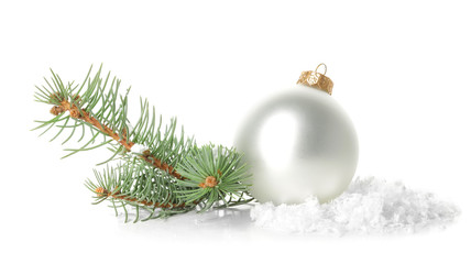 Naklejka na ściany i meble Beautiful Christmas ball with snow and fir tree branches on white background