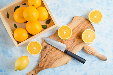 top view of the process of making fresh orange juice, flat lay