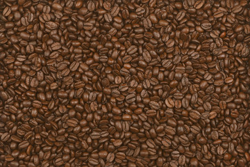 Scattering of coffee beans, close up.