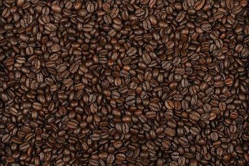 Scattering of coffee beans, close up.