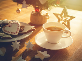 Christmas or New Year composition with gingerbread cookies, coffee and christmas decorations. Christmas decorations and coffee cup. 