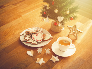 Christmas or New Year composition with gingerbread cookies, coffee and christmas decorations. Christmas decorations and coffee cup. 