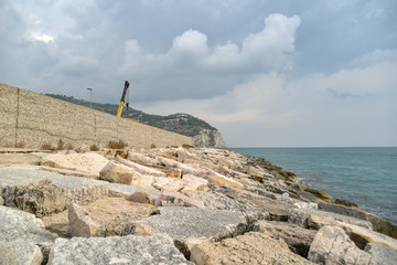 Rocks in the Beach of Mattinata with Cloudy Sky