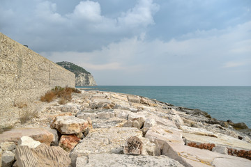 Rocks in the Beach of Mattinata with Cloudy Sky