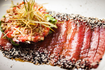 Tuna sashimi served on a plate in restaurant
