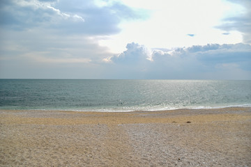 Fototapeta na wymiar Mattinata Beach by Morning with Cloudy Sky