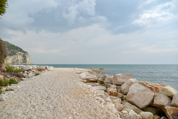 Rocks in the Beach of Mattinata with Cloudy Sky