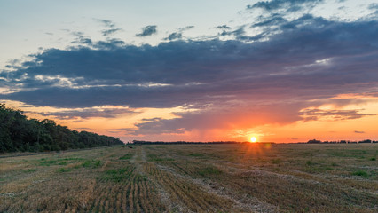 Fototapeta na wymiar Beautiful Sunrise over the field.Summer evening in Blagoveshenskaya. Anapa, Russia.
