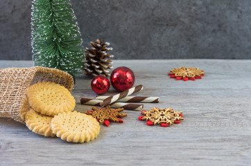 Tasty homemade Christmas cookies on wooden table, gingerbread cookies on dark wood background with copy space for text. holiday, celebration and cooking concept. closeup view