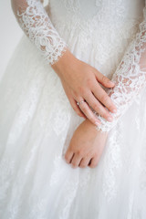 hands of bride with engagement ring