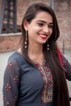Portrait of indian girl in traditional dress. Traditional accessories of Indian girls. 