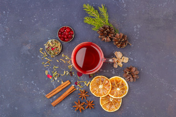 Naklejka na ściany i meble Hot spicy Christmas home made drink. Mulled wine, wine cranberry punch or Sangria with cranberries and orange for Christmas feast. Winter holidays, new year concept. Close up, copy space for text