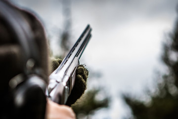 Shooter aiming at a clay pigeon, Aviemore, Scotland, UK