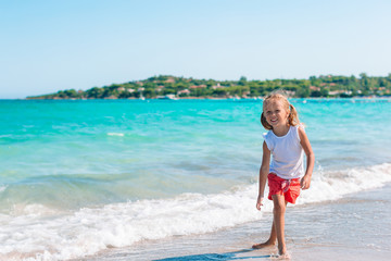 Fototapeta premium Happy kid looking at camera background beautiful sky and sea