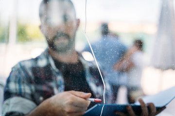 insurance agent checking broken glass in a house, homeowner's insurance