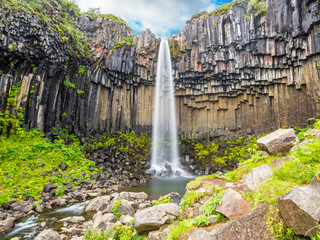View on Svartifoss waterfall with impressive basalt stone formation on Iceland in summer