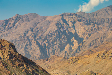 Fototapeta na wymiar mountains of Oman on the sea against the blue sky