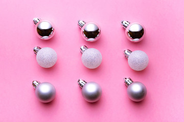 Christmas decoration balls isolated on pink background. Xmas pattern. Flat lay. Pattern winter bubble concept