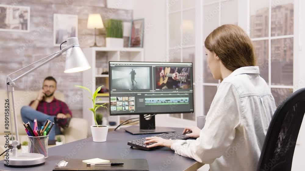 Poster side view of video editor working on a project