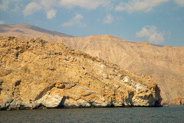 mountains of Oman on the sea against the blue sky