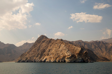 mountains of Oman on the sea against the blue sky