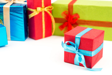 Gift boxes with ribbons and christmas decor isolated on white background. Happy birthday colorful gifts