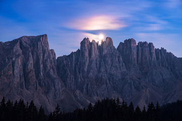 Night in Dolomites. Mountains over lake Carezza, Italy