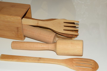 kitchen utensils on wooden board