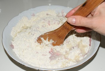 kneading the dough for the cake