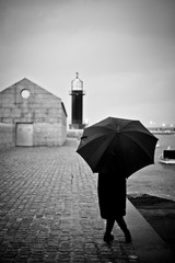 silhouette of woman with an umbrella
