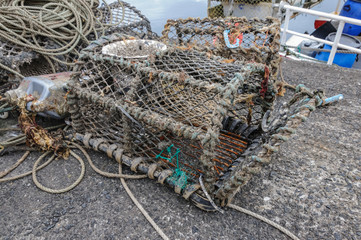 Crab traps or pots in the harbor of the small fishing village of Carnlough in Northern Ireland.