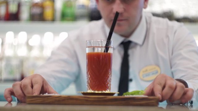 Bartender serves bloody mary cocktail 4