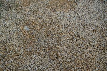 Brown and White pebble stone texture for background. The texture of brown gravel stones.